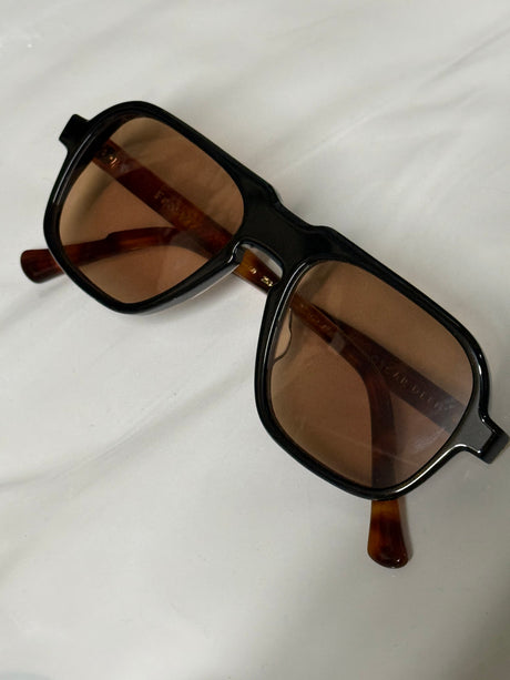 Actual Oscar Deen Fraser Two Tone Coal Sunset pair: black front, tortoiseshell arms and warm tinted lenses